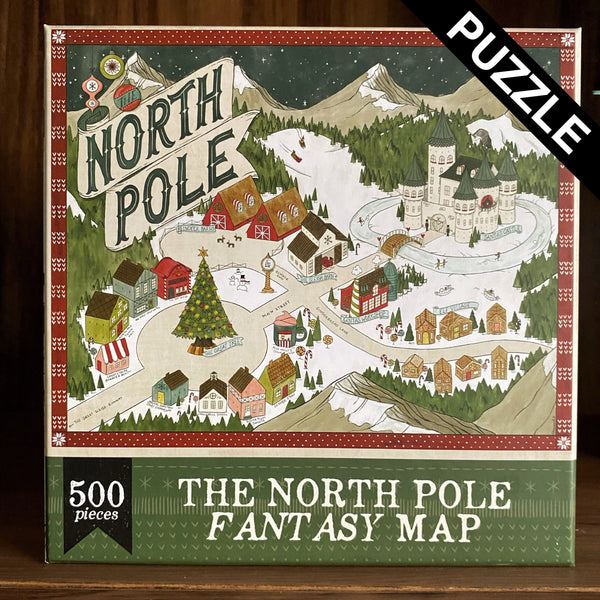 Image shows a 500 piece puzzle with a hand-drawn fantasy-style map of the North Pole at Christmas