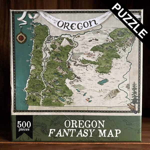 Image shows a 500 piece puzzle with a hand-drawn fantasy-style map of Oregon