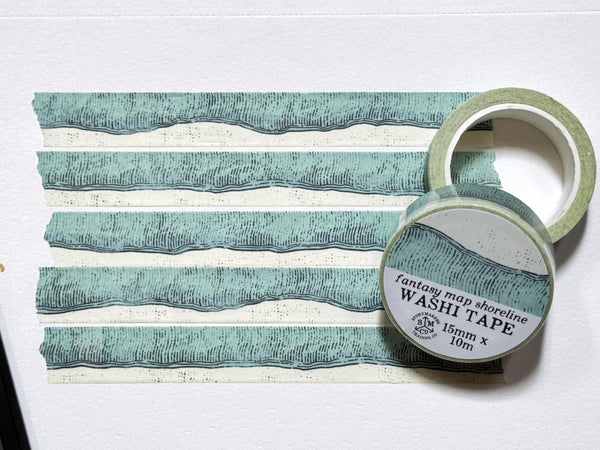 Washi tape with hand-drawn shoreline and water in a fantasy map style.