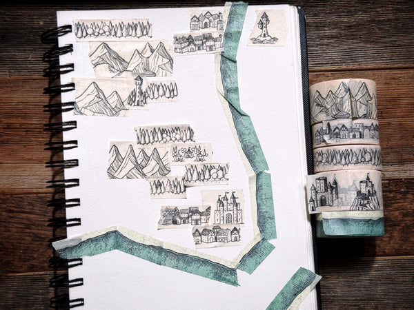 Image of various washi tape designs being used to create an impromptu fantasy map.