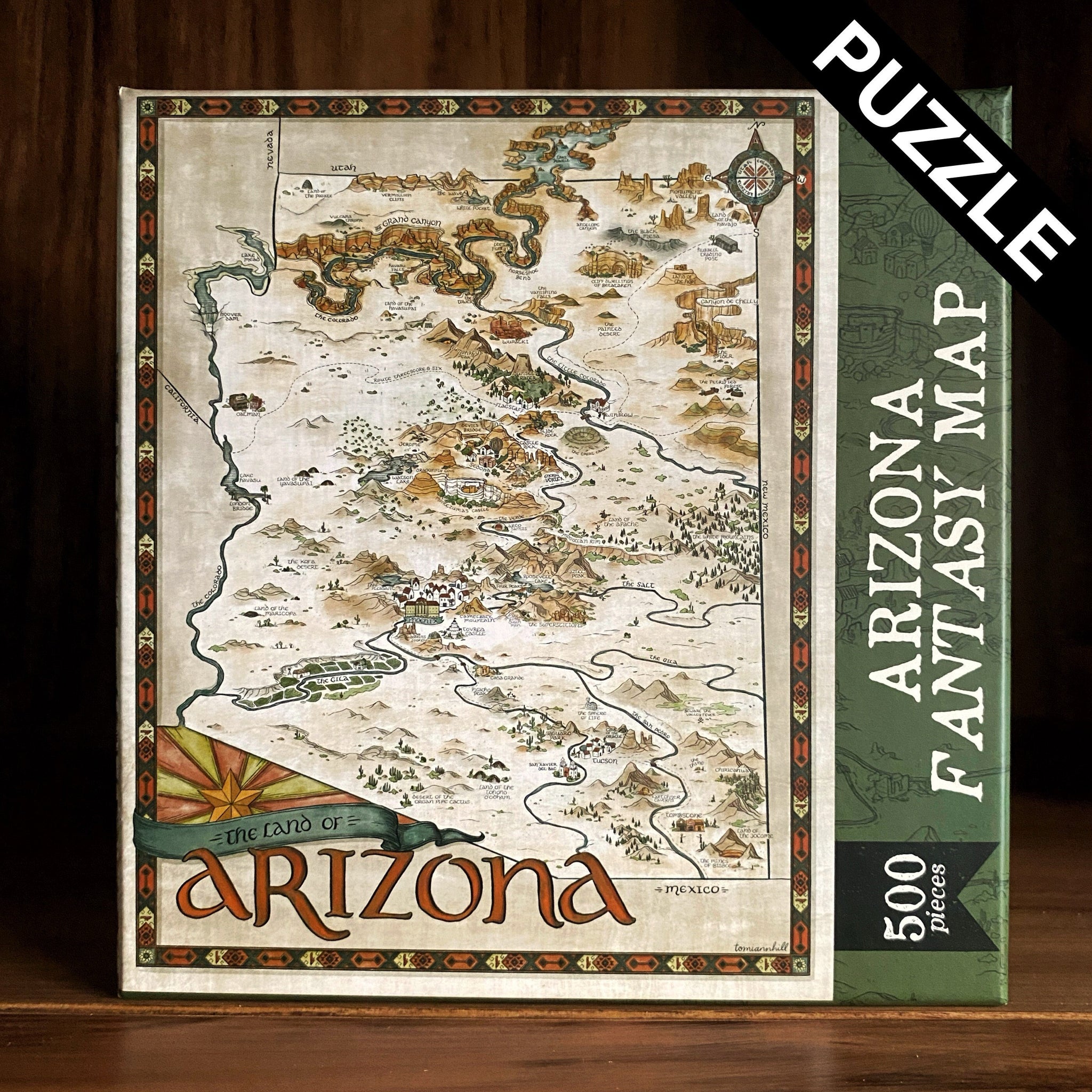 Image shows a 500 piece puzzle with a hand-drawn fantasy-style map of Arizona
